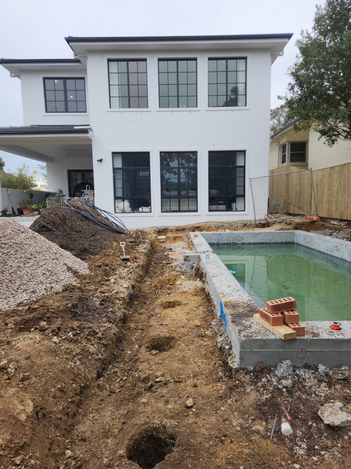 During construction - concrete pool shell formed with services trenching underway at the Chatswood property
