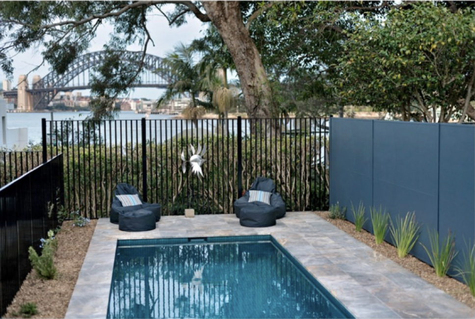 Pool terrace with outdoor seating and views to the Sydney Harbour Bridge