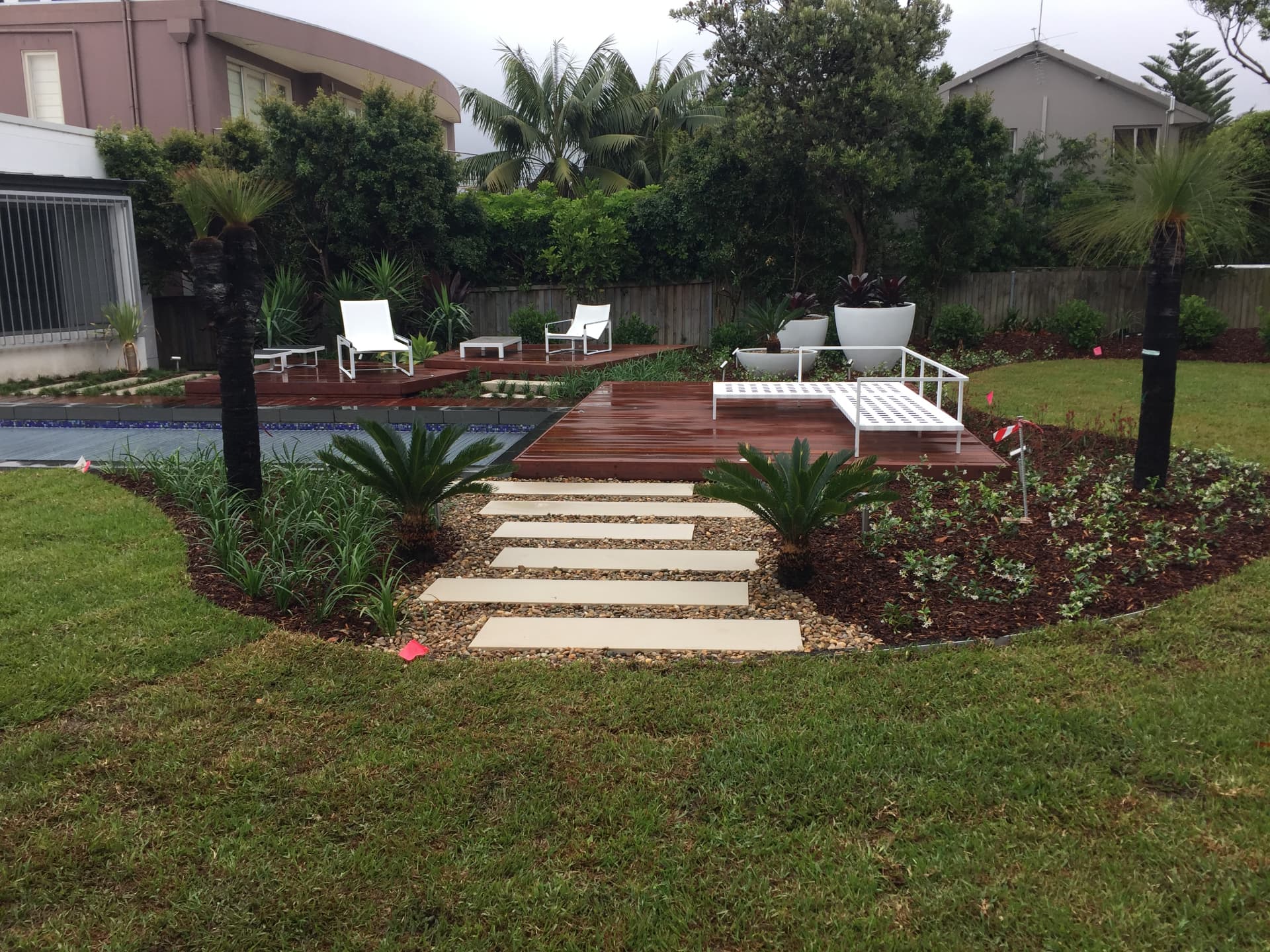 Step stone pathway through new garden beds leading to the Dover Heights deck and pool