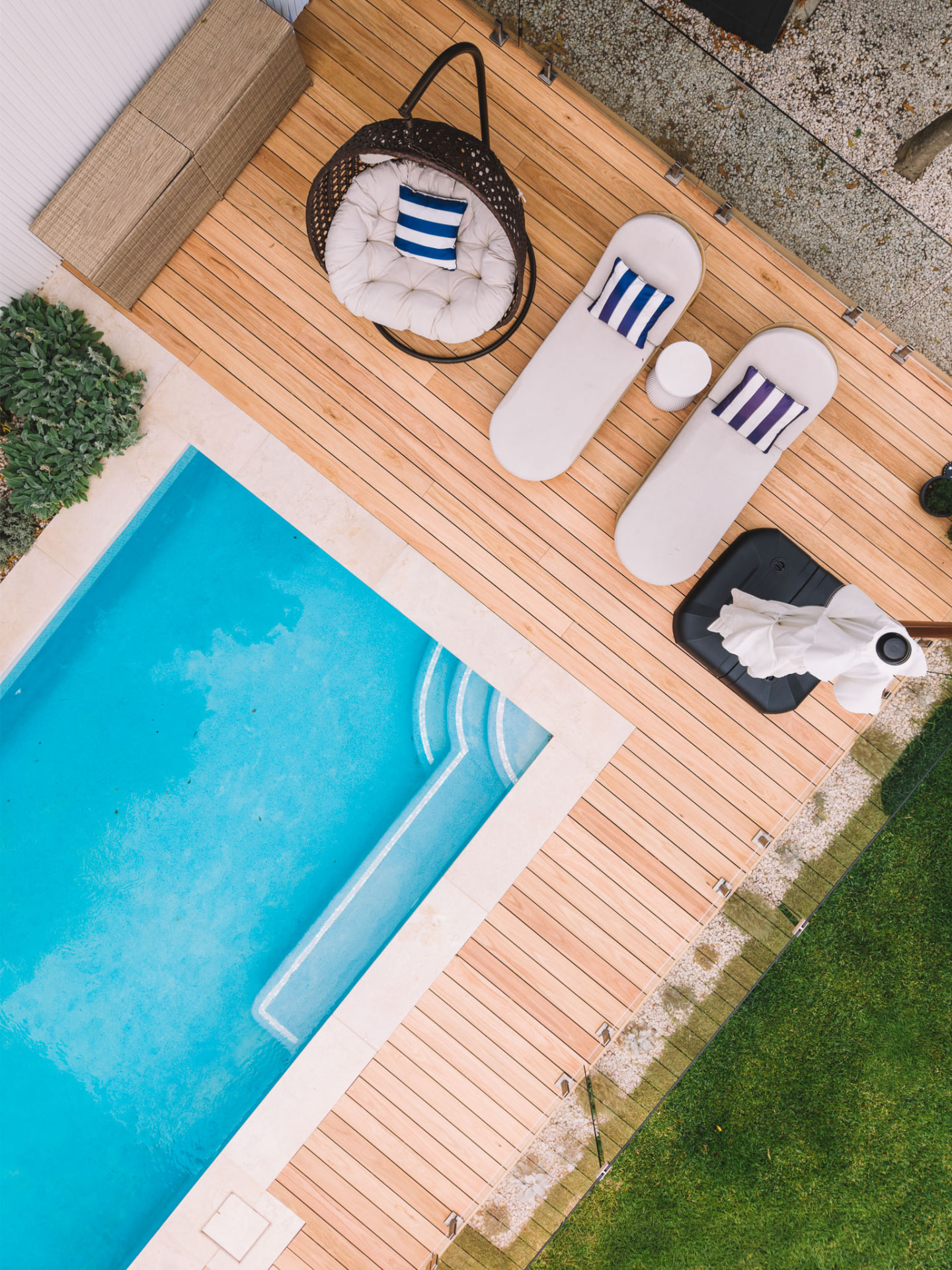 Aerial view of the completed Chatswood pool deck with hanging chair, sun loungers and glass fencing
