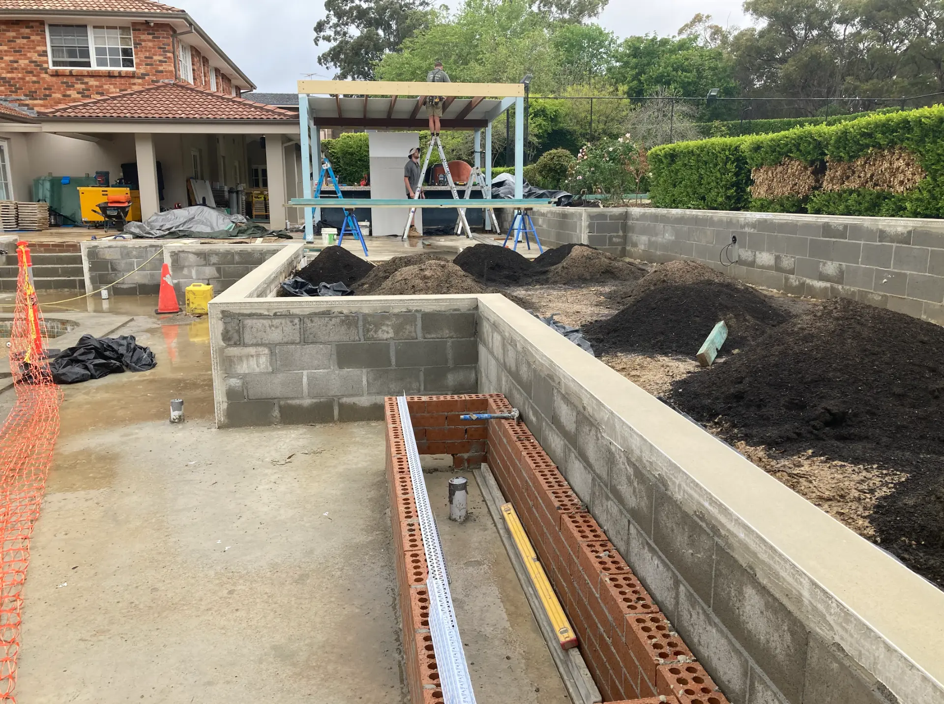 During construction - retaining walls, drainage and outdoor structure taking shape in North Turramurra