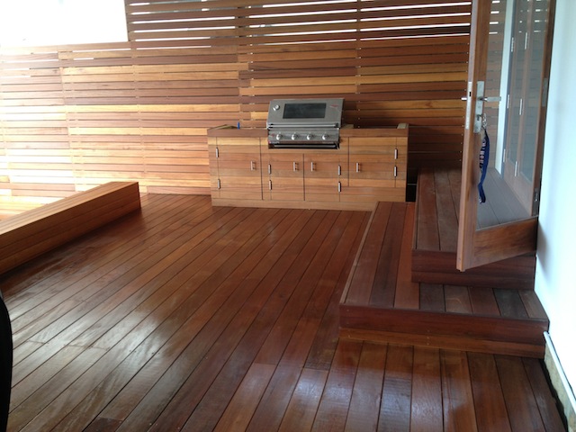 Finished hardwood deck with built-in BBQ and timber privacy screening in Kingsford