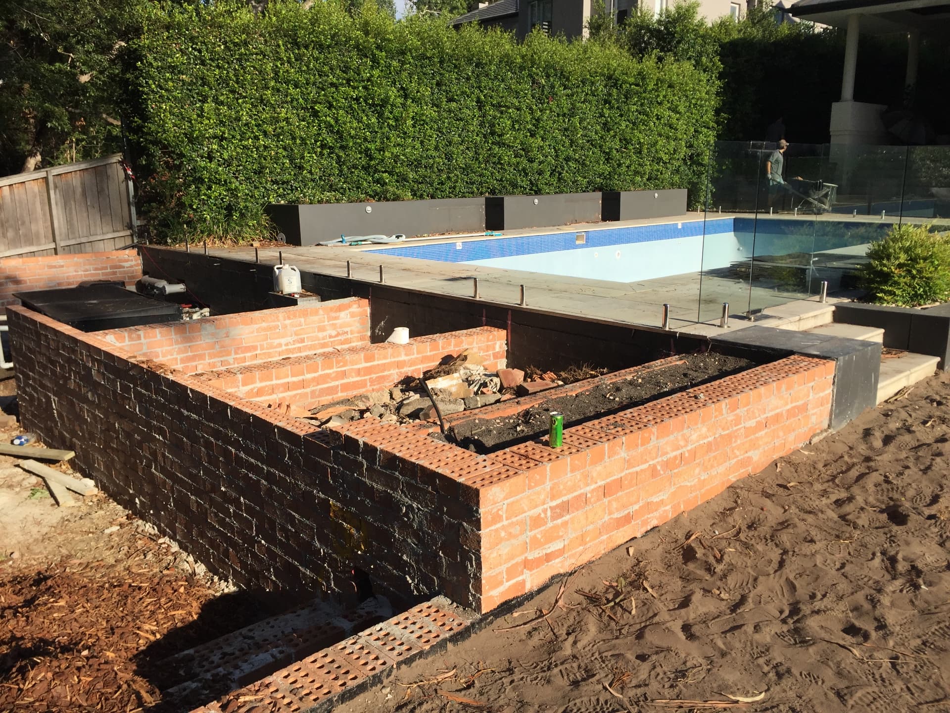 The Warrawee pool mid-renovation with new brick planter walls under construction