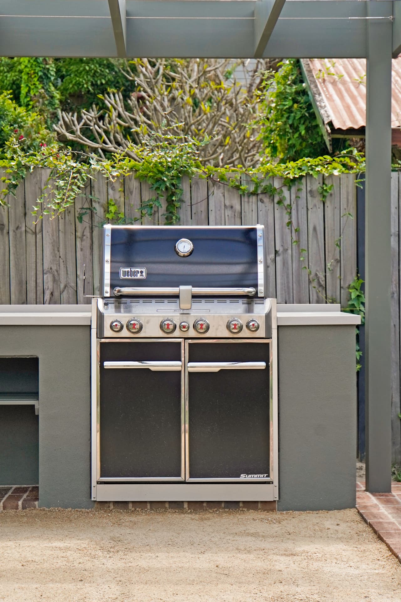 Built-in Weber BBQ with Caesar stone bench tops in the Haberfield outdoor kitchen