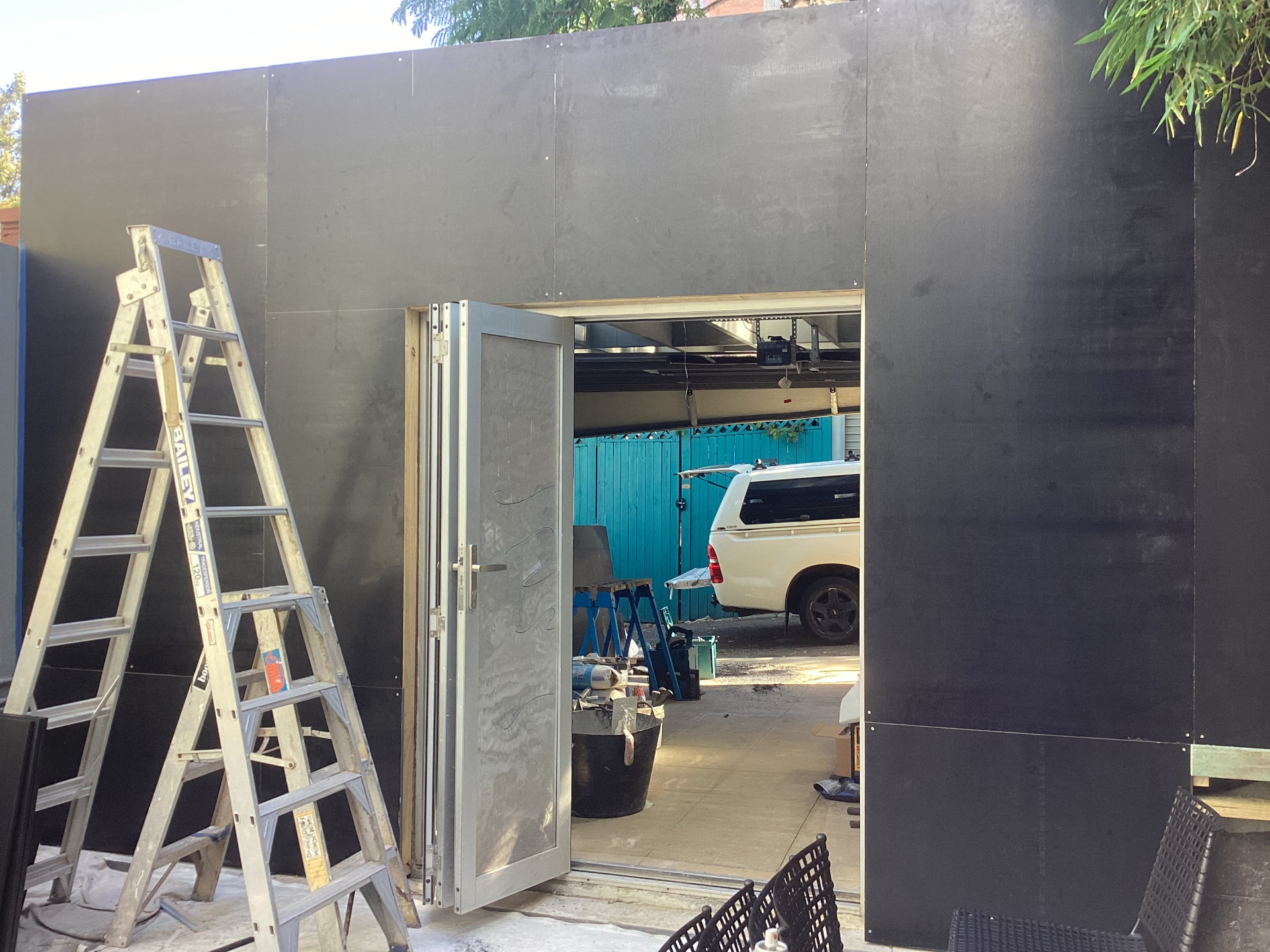 During construction - courtyard wall and doorway installation in progress at the Darlinghurst property