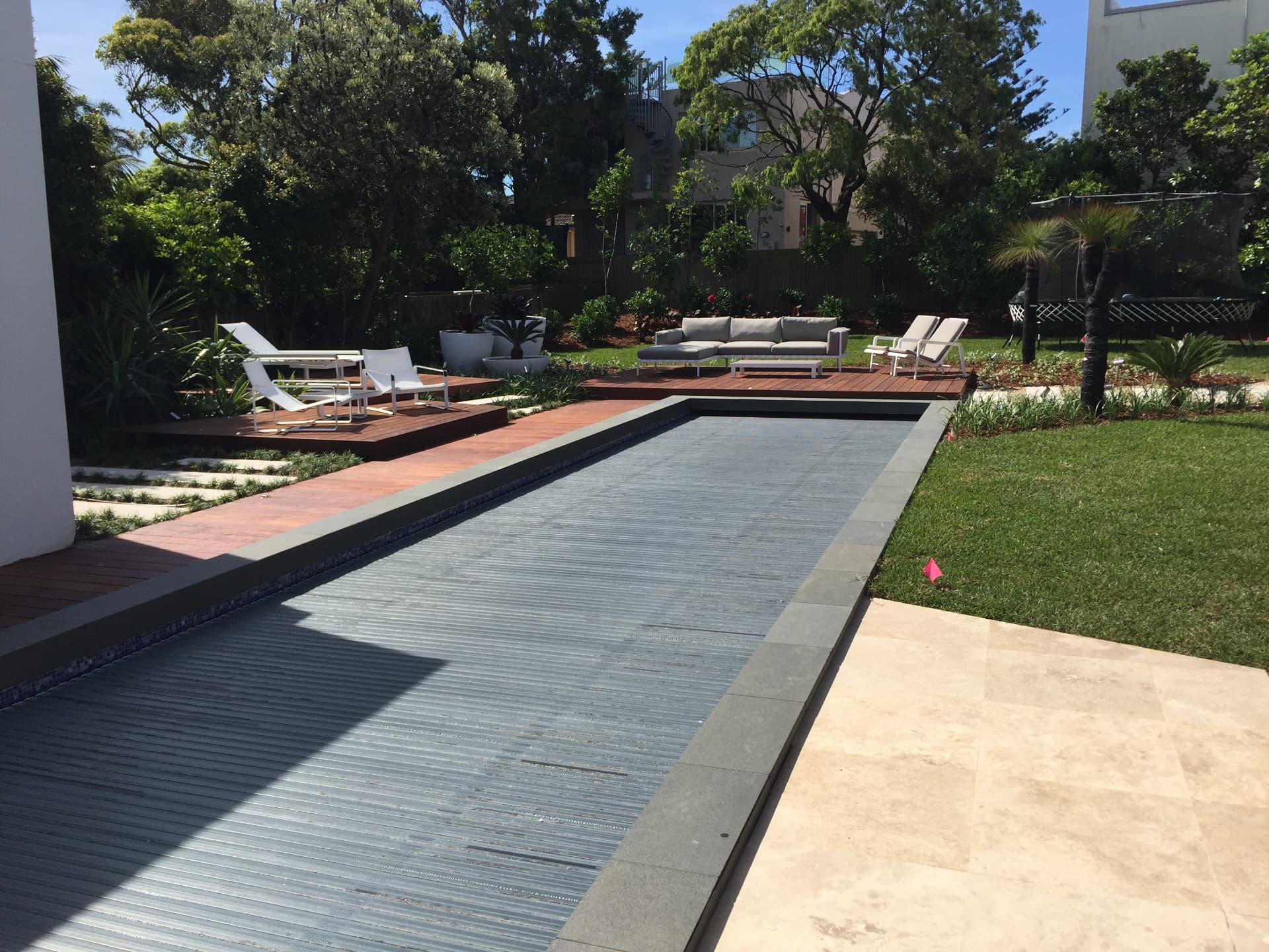 Renovated Dover Heights lap pool with hardwood decking, lounges and new gardens