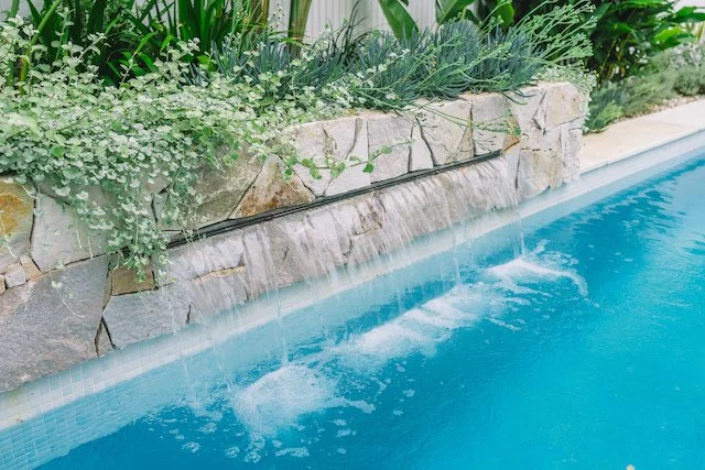 Detail of the sandstone spillway water feature cascading into the Chatswood pool