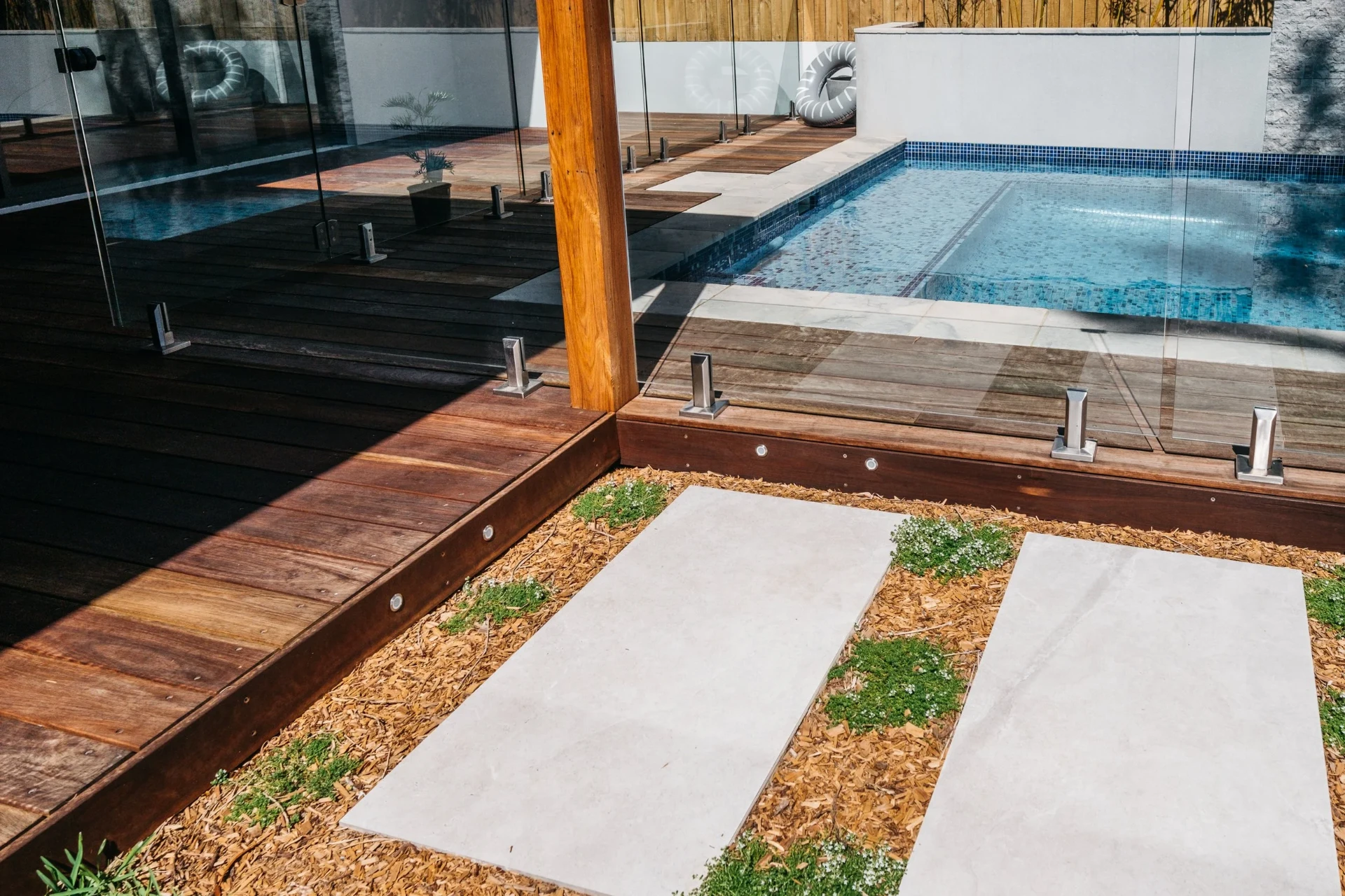 Hardwood deck, glass pool fencing and step stone path at Freshwater