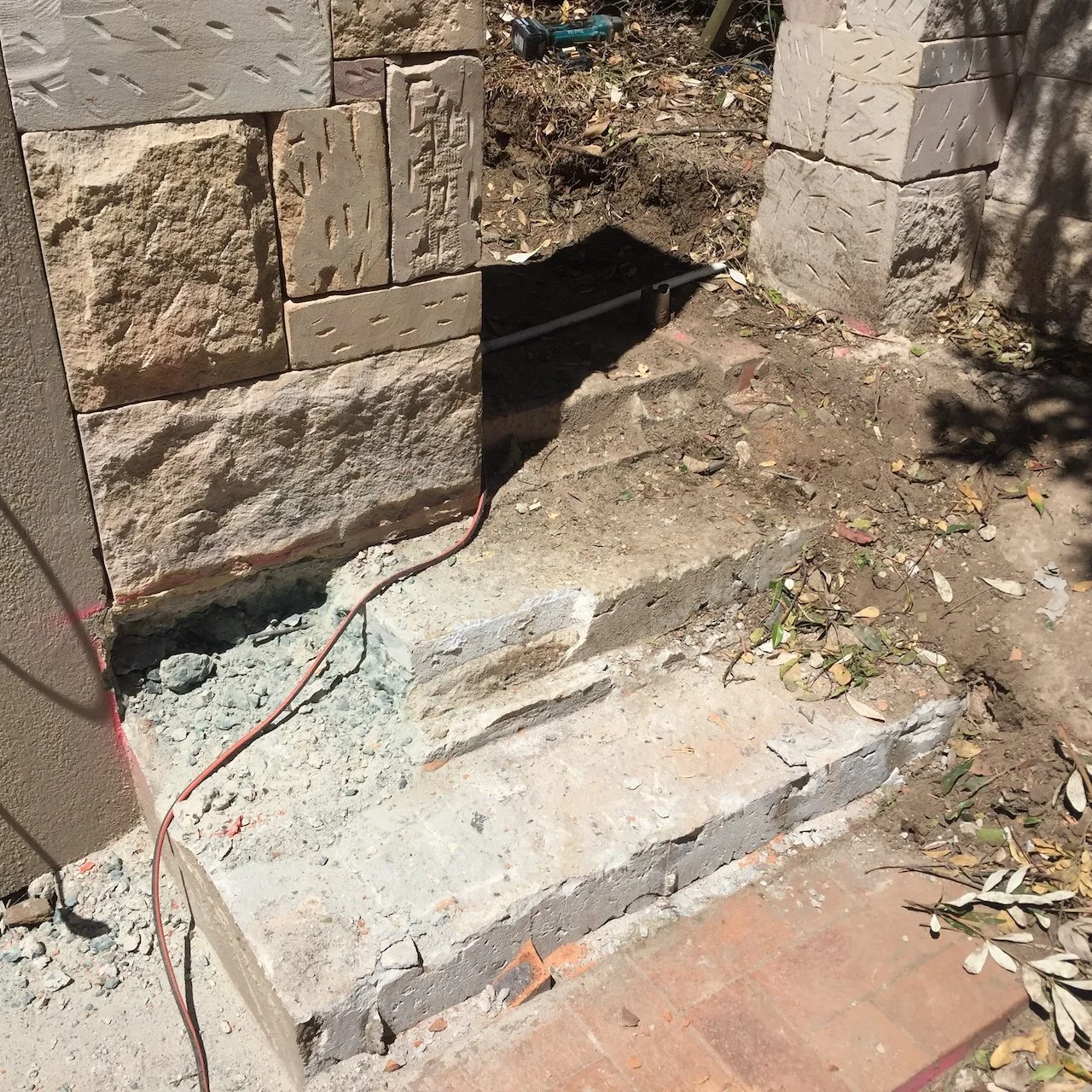 Sandstone clad wall and step construction in progress