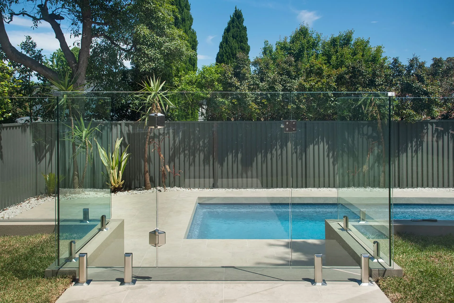 Frameless glass pool fencing along the Riverview pool terrace