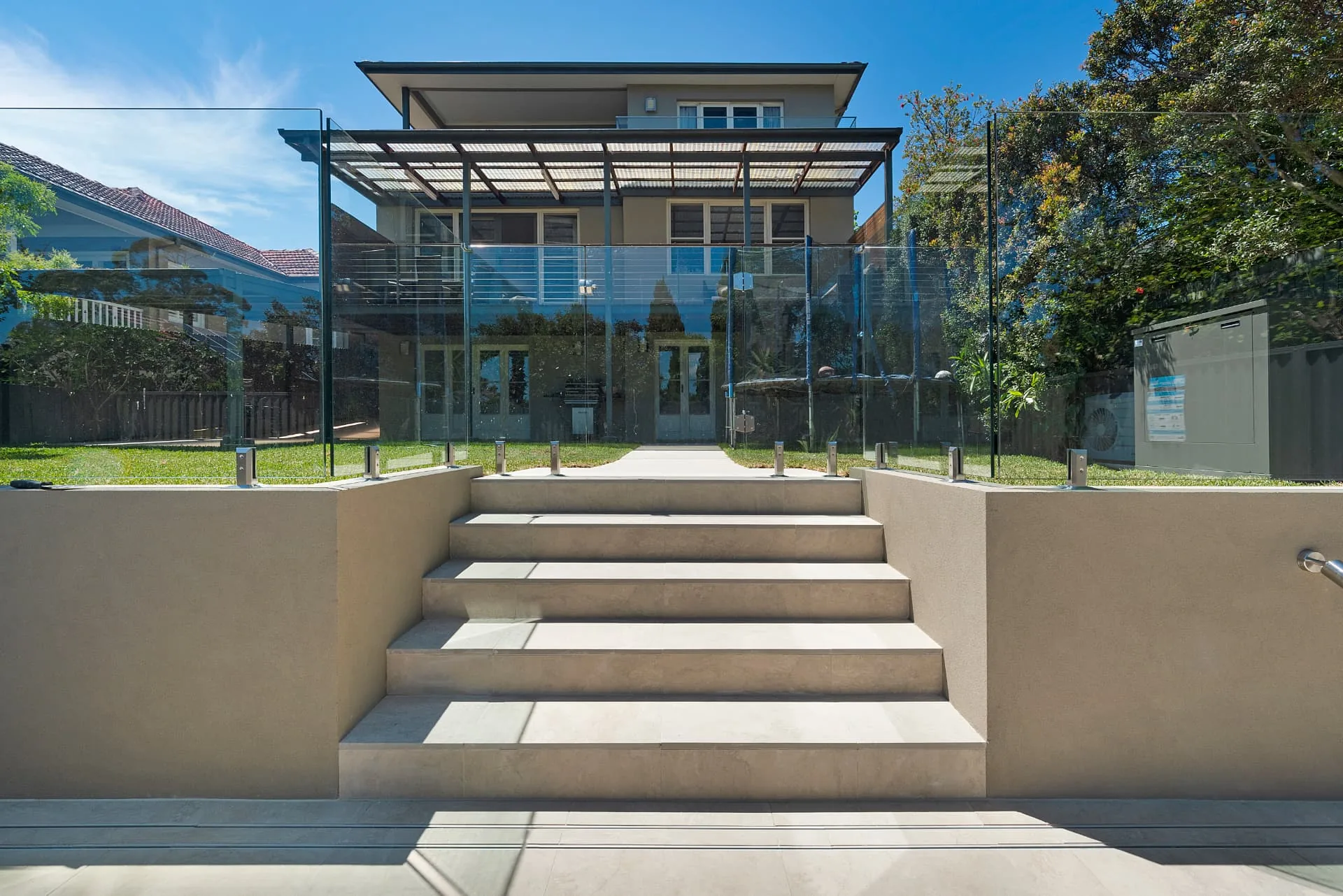 Feature stairs and rendered walls looking back to the Riverview home