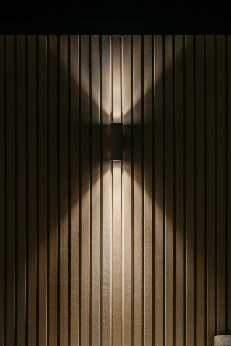 Up-down wall light washing the vertical timber batten walling at night