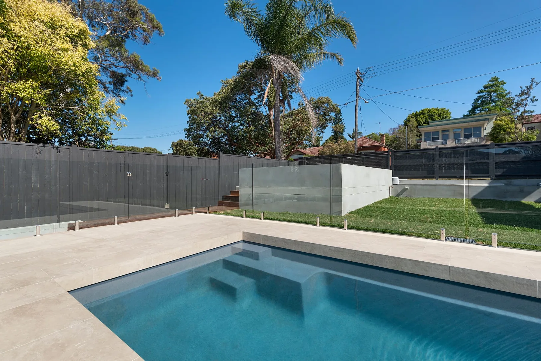 Seaforth pool and lawn viewed from the side terrace