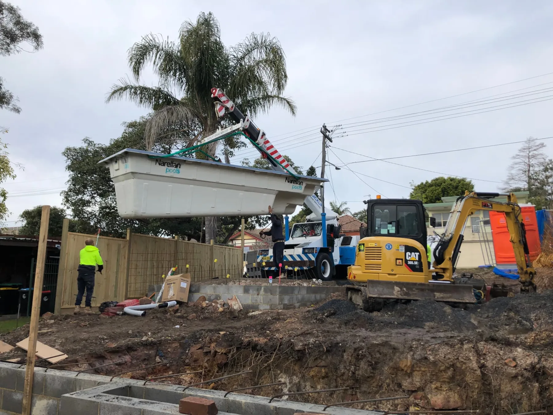 During construction - the pool shell craned into the excavated Seaforth backyard